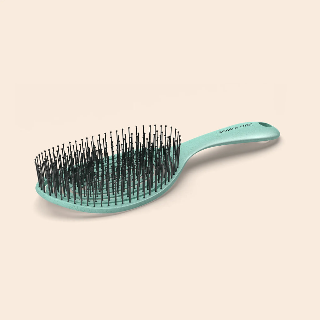 Bounce Curl Detangling Brush - product flat lay with ultra-flexible nylon bristles